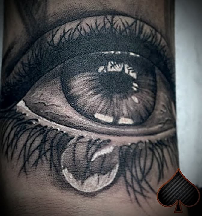 Crying eye black and grey realism tattoo — detail work by Spade